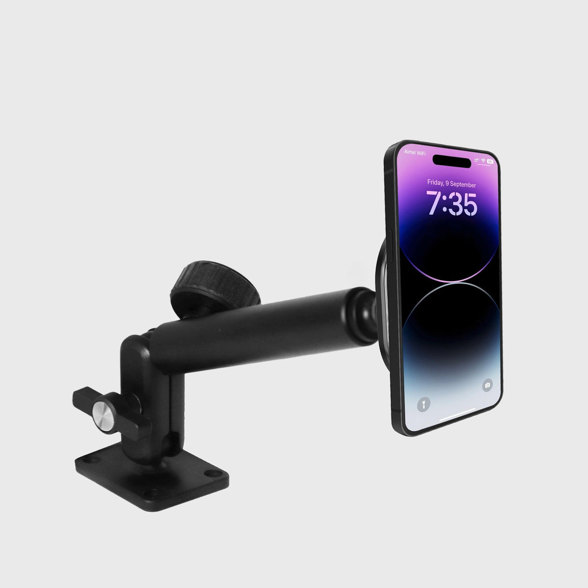 Close-up of black magnetic car phone mount with adjustable arm and suction cup base, designed for secure smartphone attachment