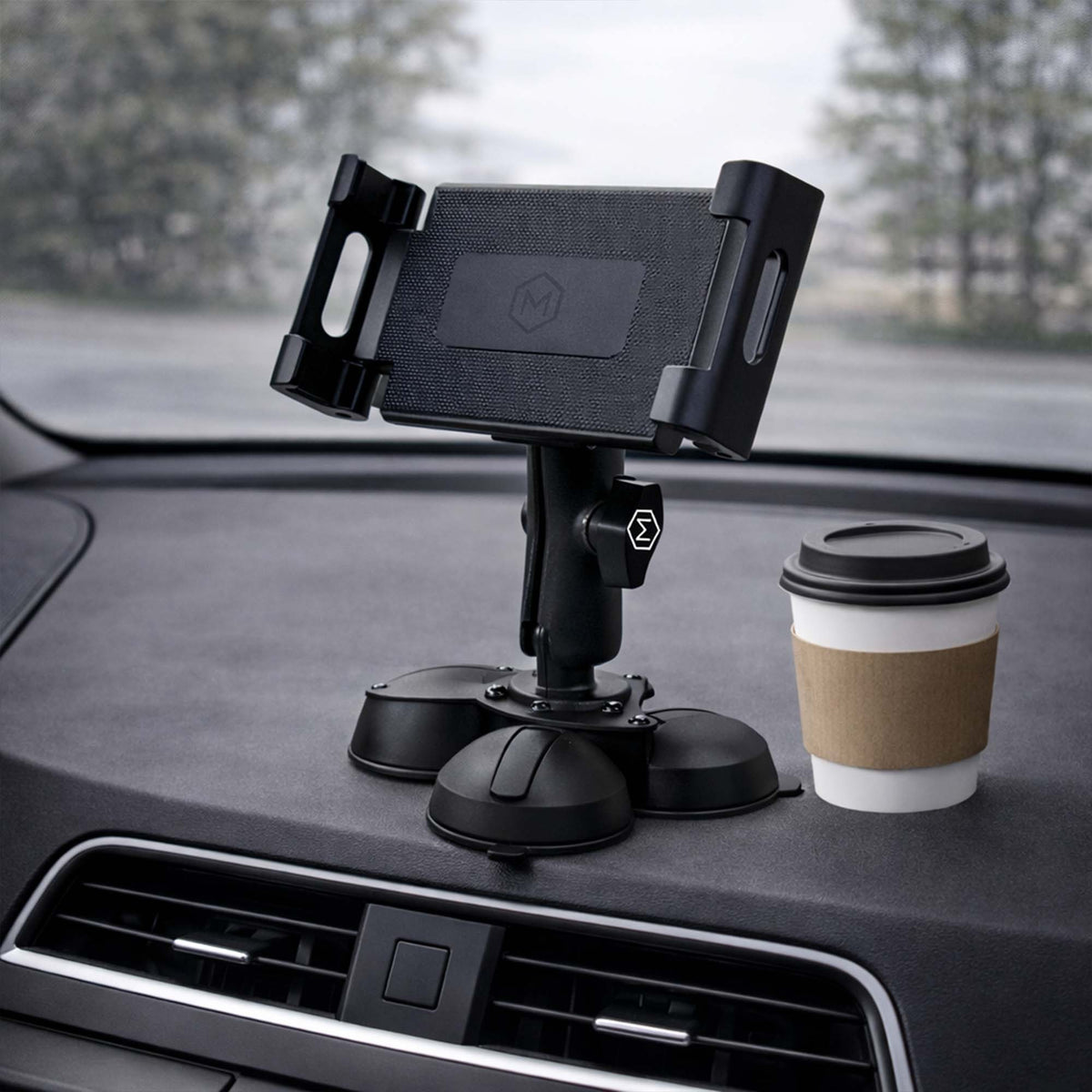 Close-up of black industrial mount with suction cups and adjustable arm, used for securing tablets in vehicles, SKU: M9500-B3