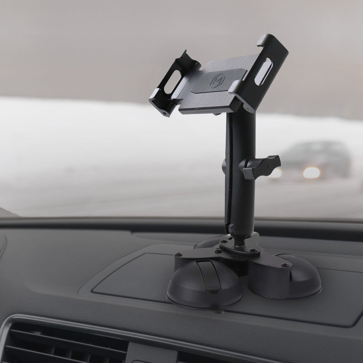 Vehicle dashboard with heavy duty triple suction mount holding a tablet, black plastic, adjustable arms, SKU: M9500-B3