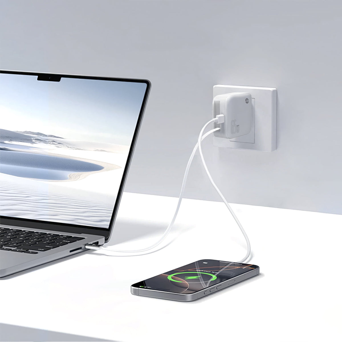 Close-up of the white foldable wall charger connected to a laptop, showing sleek design and cable management for convenience