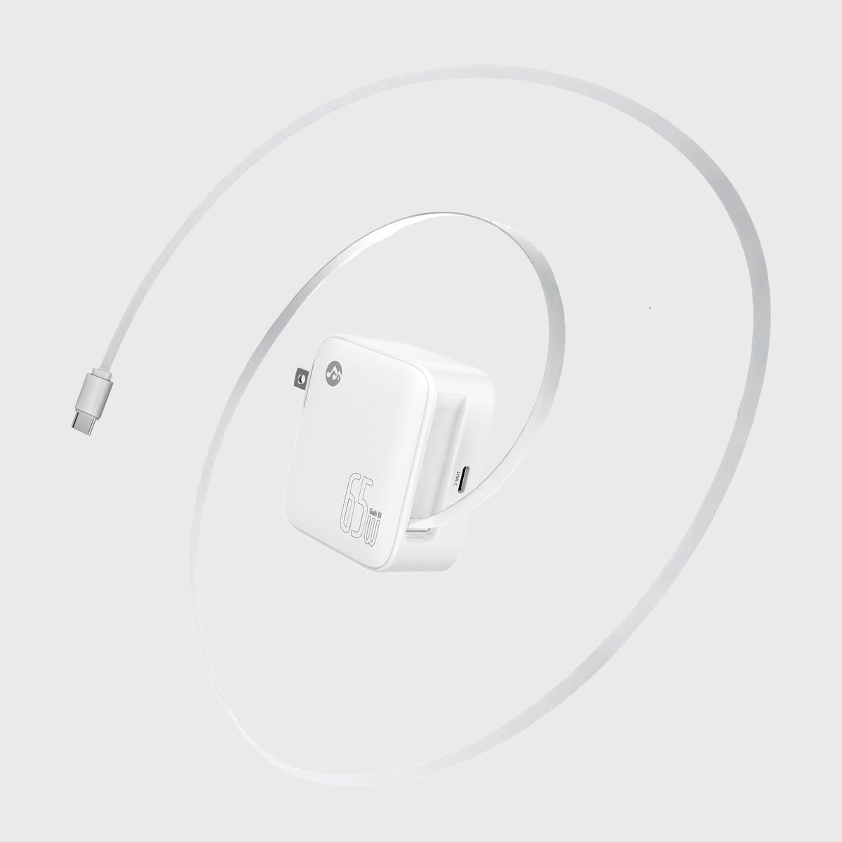 Wireless charging pad with a smartphone, and the white foldable wall charger plugged into a nearby wall outlet, emphasizing fast charging